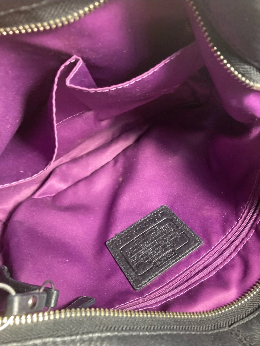 Coach black pebbled leather Carly hobo shoulder bag with silver hardware.